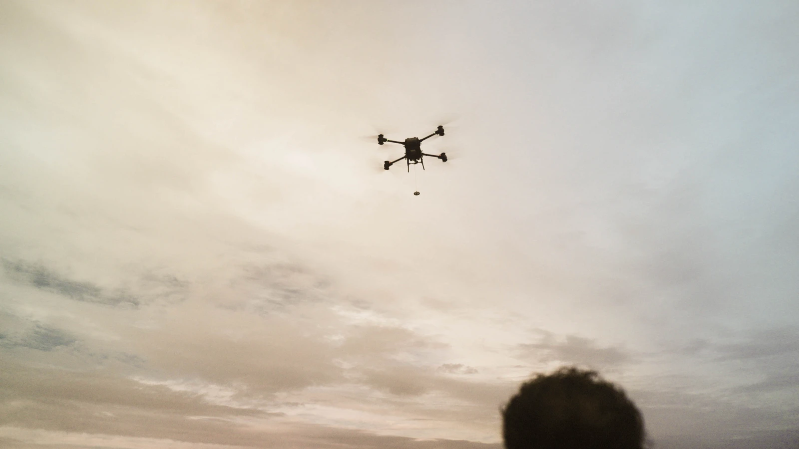Drone Lift crew and heavy-lift drone at telecom operation